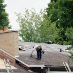 Barrie roofing. 2 men installing a new roof in Barrie