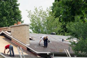 Barrie roofing. 2 men installing a new roof in Barrie