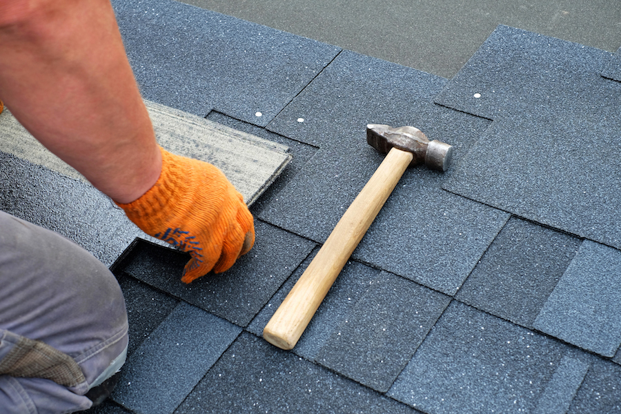 a barrie roofing contractor installing shingles