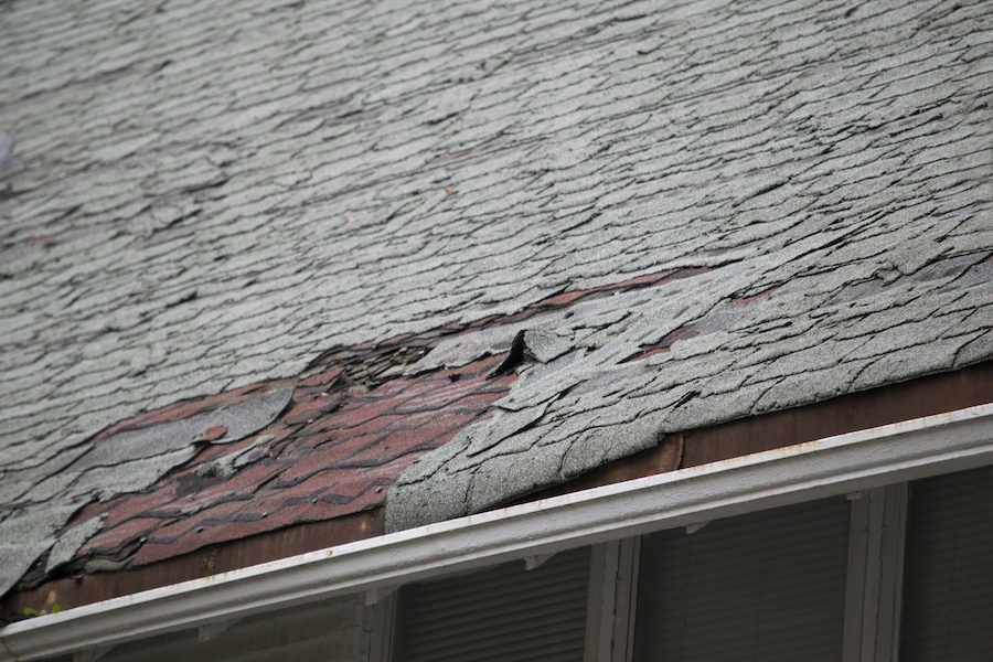 a roof in Collingwood with the roof peeling away