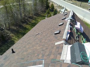 roofers in barrie fix a shingle