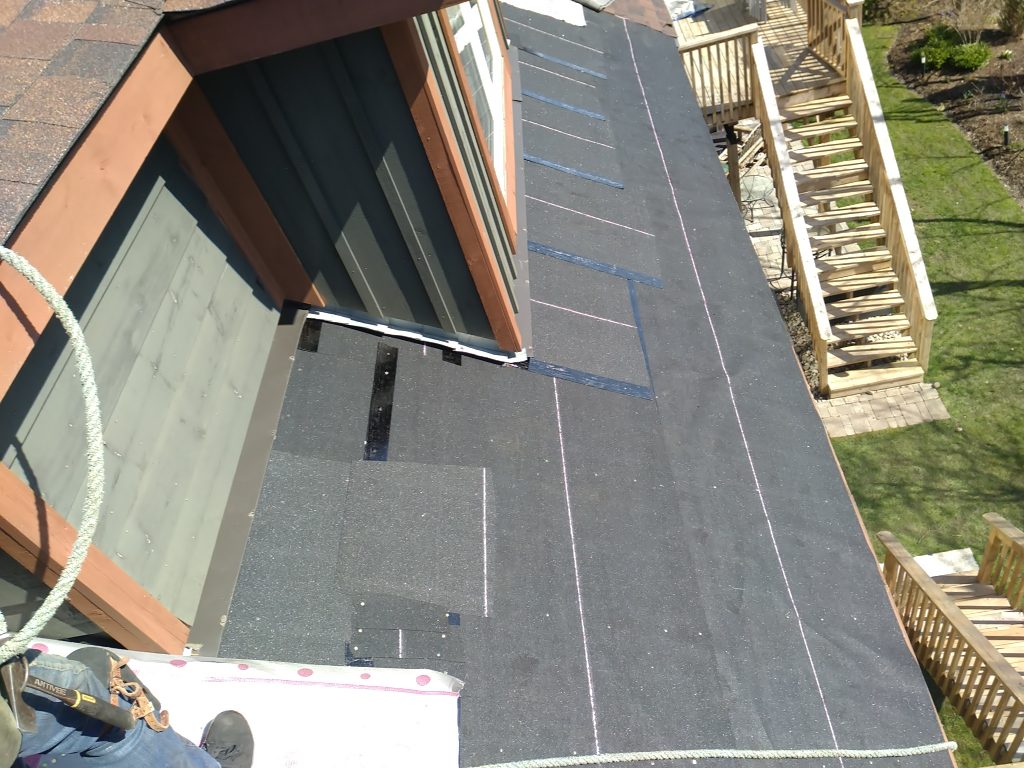 roofing company in Barrie fixes a black roof