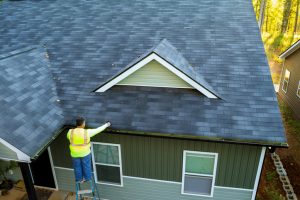 A man inspecting a roof in barrie Ontario