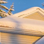 Snow-covered roof with no icicles, ensuring safe snow load in winter