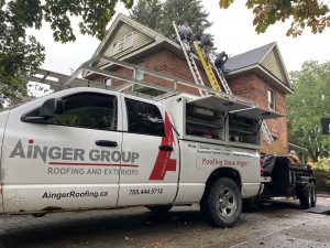 Technician performing a Roof Inspection in Barrie on a residential home