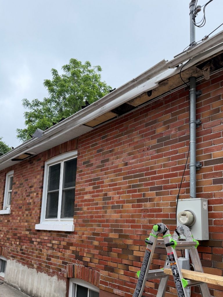 Old and worn out soffit, fascia and eavestrough