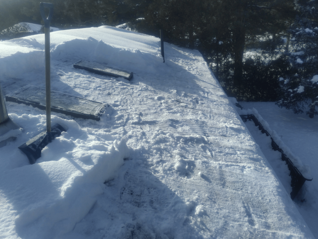 Rooftop snow removal by professional crew