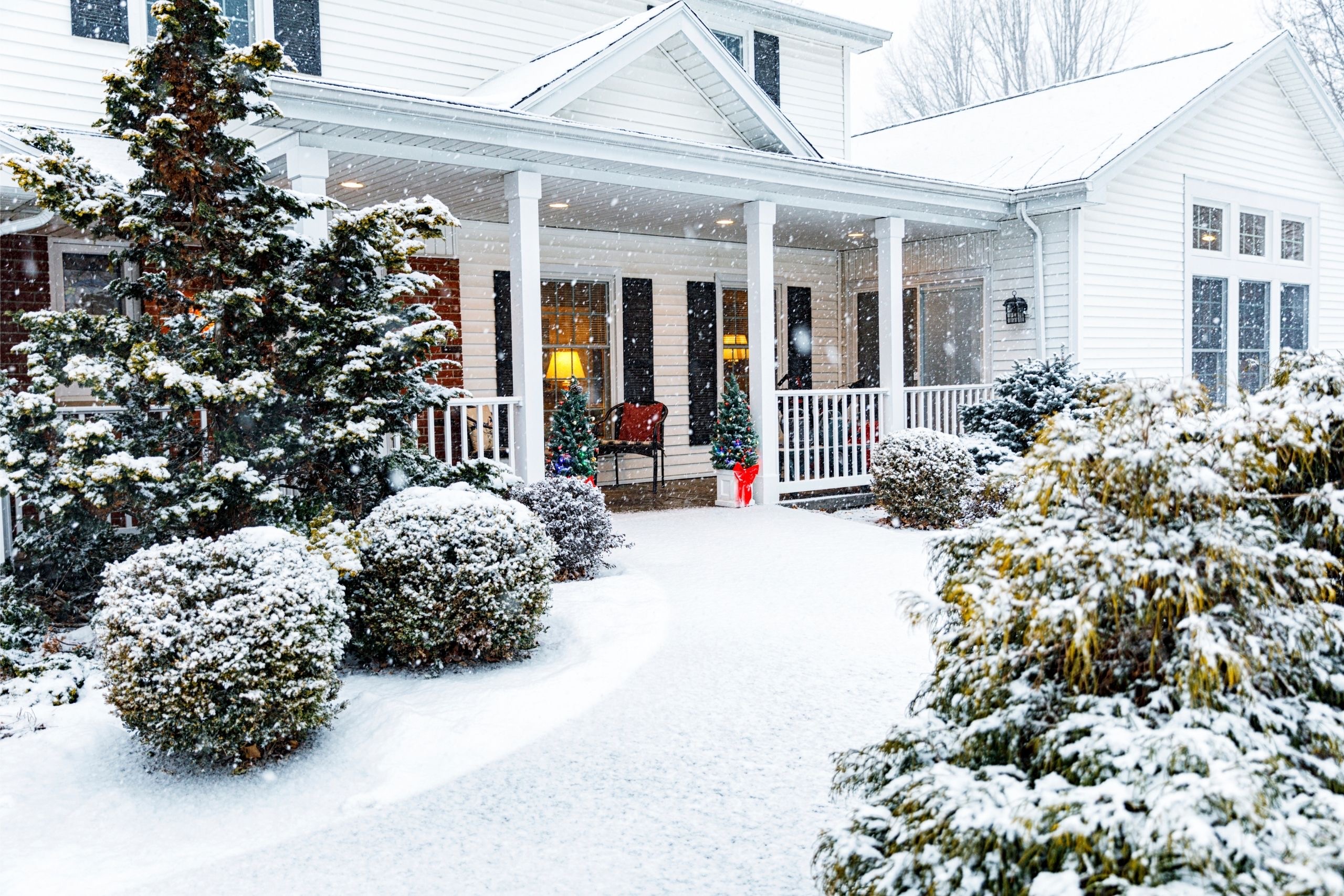House in the winter with the rooftop covered in snow