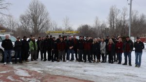 Ainger Group team gathered outside its Collingwood office during winter.