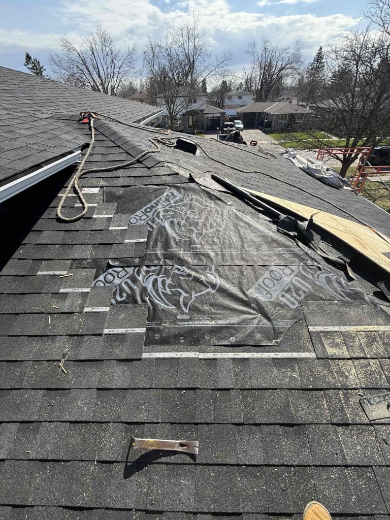 Technician performing a Roof Inspection in Barrie on a residential home