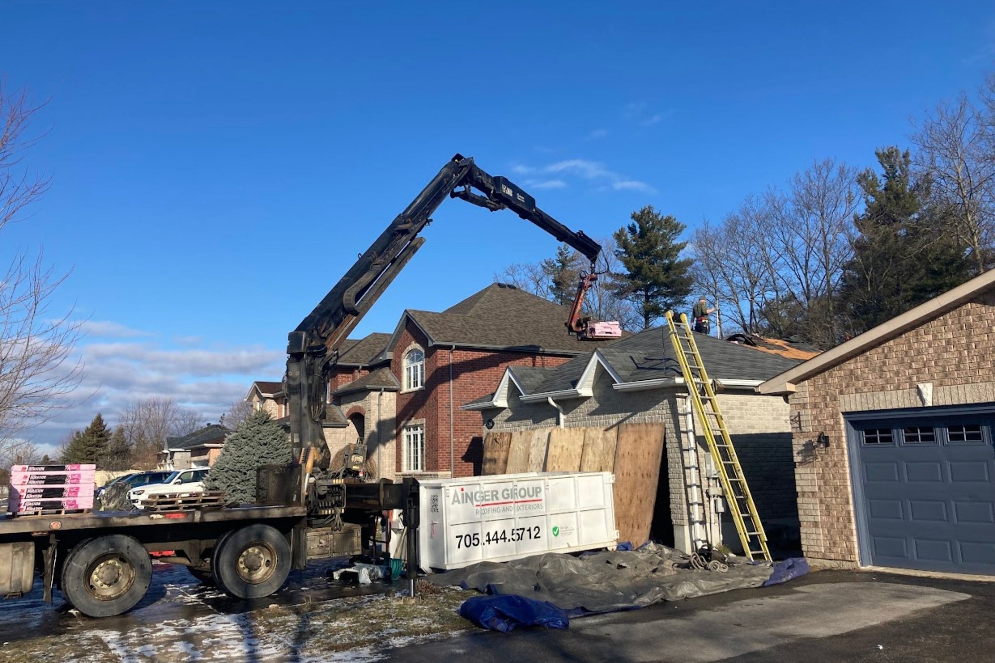 Ainger Group crew completing a residential shingle roof replacement in Collingwood, Ontario.